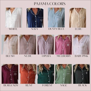 May include: A chart showing 12 different colors of pajamas with white piping. The colors are white, navy, dusty blue, ecru, blush, nude, opera, mulberry, baby pink, burgundy, rust, forest, sage, and black.