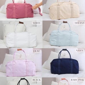 May include: Eight cotton canvas weekender bags in different colors: deep mauve, champagne, white, tiffany, lilac, navy, black, and baby pink.  Cotton Canvas Weekenders Colors.