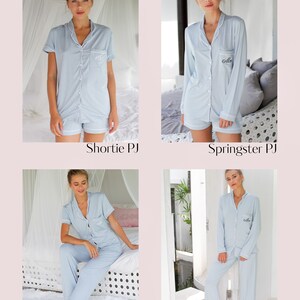 May include: Four different styles of light blue pyjamas with white trim and embroidery. The pyjamas are shown on models in various poses. The styles are called "Shortie PJ", "Springster PJ", "Midnight PJ", and "Winterland PJ".
