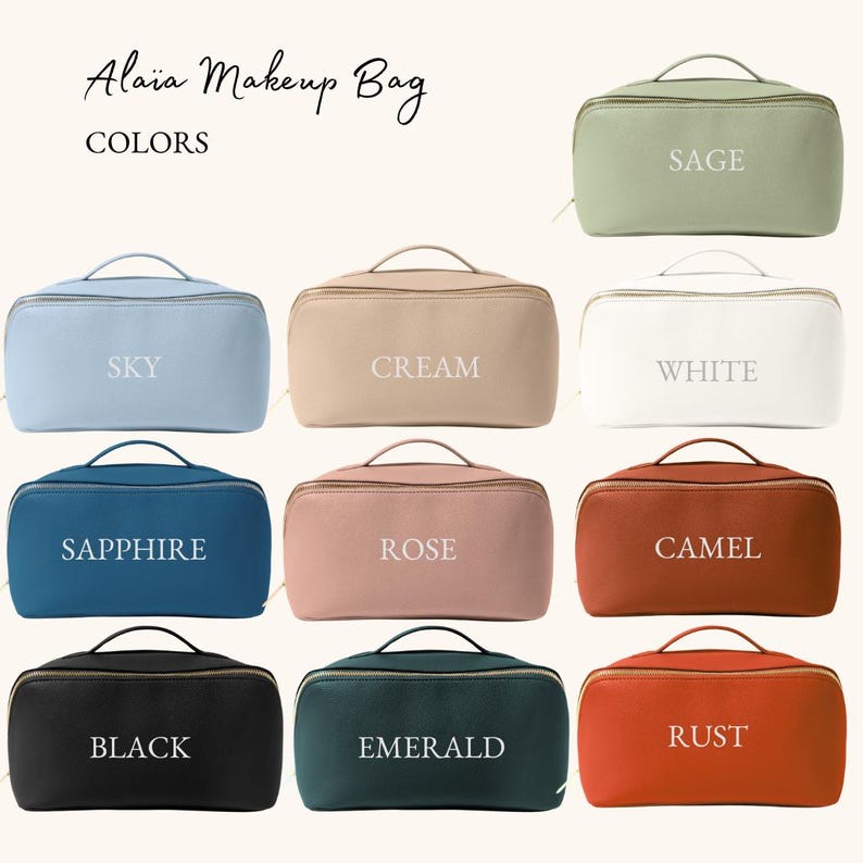 May include: A set of 10 makeup bags in various colors, including sage, white, sky, cream, sapphire, rose, camel, black, emerald, and rust. Each bag has a zipper closure and a white text label with the color name.