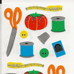 May include: A sheet of colorful sewing themed stickers. The stickers include scissors, spools of thread, buttons, thimbles, measuring tapes, and pincushions.