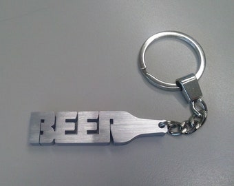 Cerveza, botella de cerveza estilizada, escritura de cerveza, llavero de cerveza de aluminio