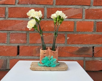 Driftwood vase, driftwood and brick vase, test-tube vase, flowers in test tube, test tube in brick on driftwood