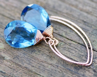 Pendientes de topacio azul claro de Londres en oro rosa laminado de 14k, piedra natal de diciembre