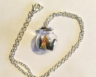 Necklace with miniature origami in a jar