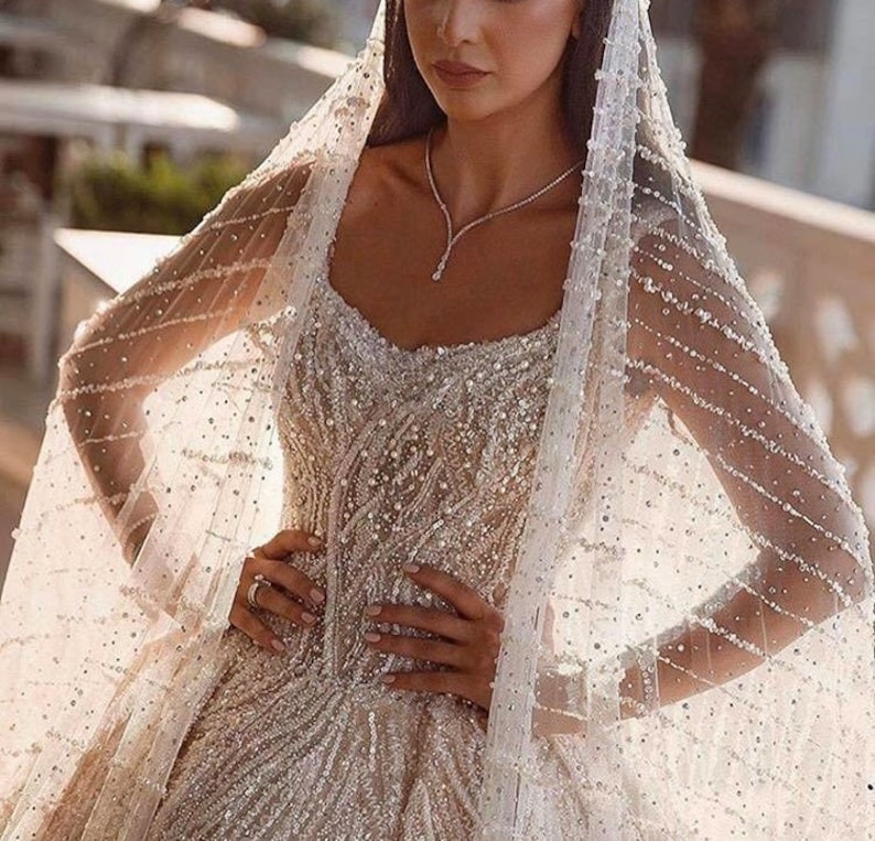 Elegant Beaded Wedding Dress with Veil – Timeless Bridal Glamour