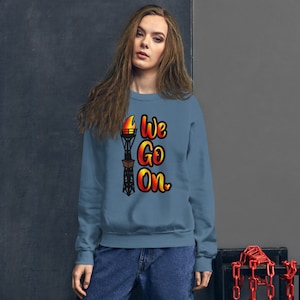 We Go On - Illuminations Fire Flame Torch - Unisex Sweatshirt - Inspired by Disney World and Disneyland - Epcot Fireworks - Sizes up to 5XL