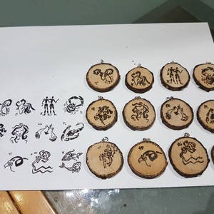 wood pendant engraved with zodiac signs with adjustable drawcord