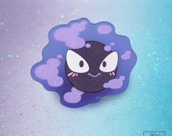 May include: A purple and black cartoon ghost character with a smiling face. The ghost is surrounded by purple clouds. The text "PEN WINTER" is at the bottom of the image.