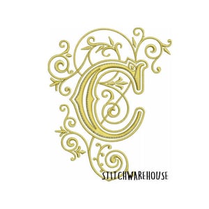 May include: Gold embroidered letter C with ornate floral embellishments. The letter is in a traditional script font and the design is reminiscent of a monogram.
