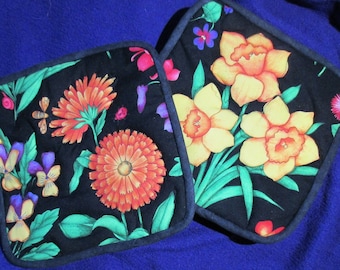 big flowers quilted hotpads, yellow daffodils, orange dahlias, sweet violas, on black, canvas back, 8 inch , Insulbrite lining, hanging loop