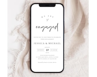 May include: A smartphone displays a minimalist engagement announcement. The text reads "We are engaged" in elegant script, followed by details for Jessica and Michael's August 27th celebration at 4:00 PM. The invitation is set against a soft, neutral background.