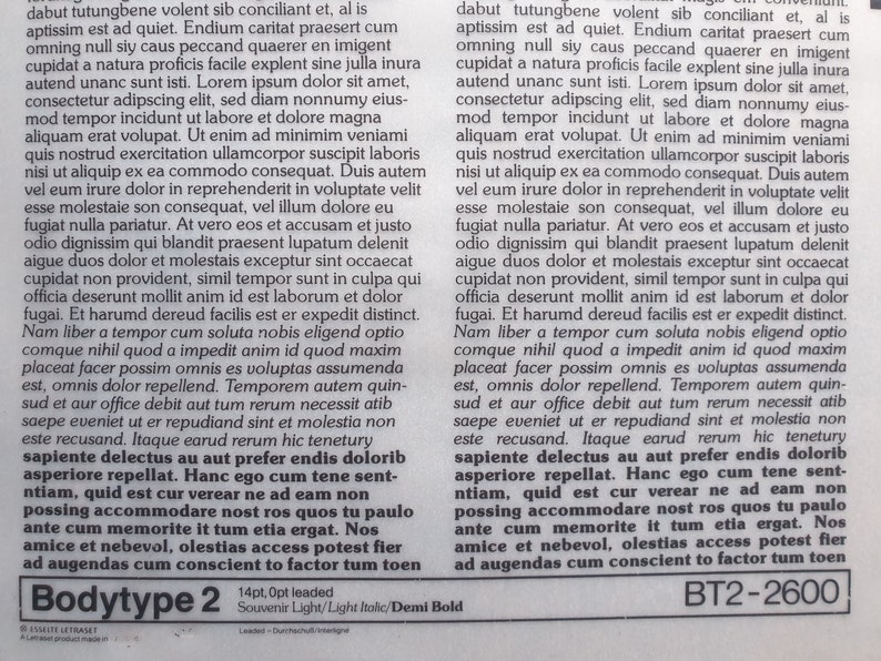 May include: A printed page with columns of text, featuring the words "Bodytype 2" and "BT2-2600" at the bottom. The text is in a light, italicized font, with a sample of the font's appearance.
