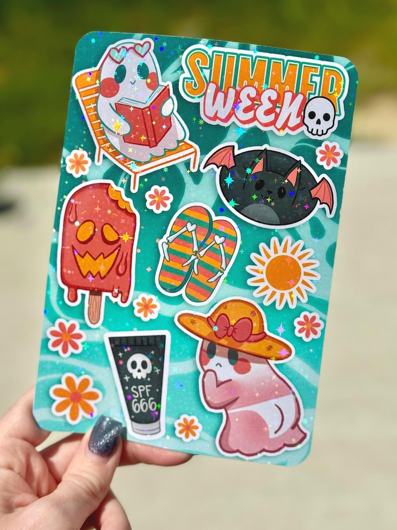May include: A teal sticker sheet with summer-themed illustrations. Includes a ghost reading a book, a bat, a popsicle, flip-flops, a sun, a ghost in a hat, and SPF 666 sunscreen. The words "SUMMER WEEK" are at the top.