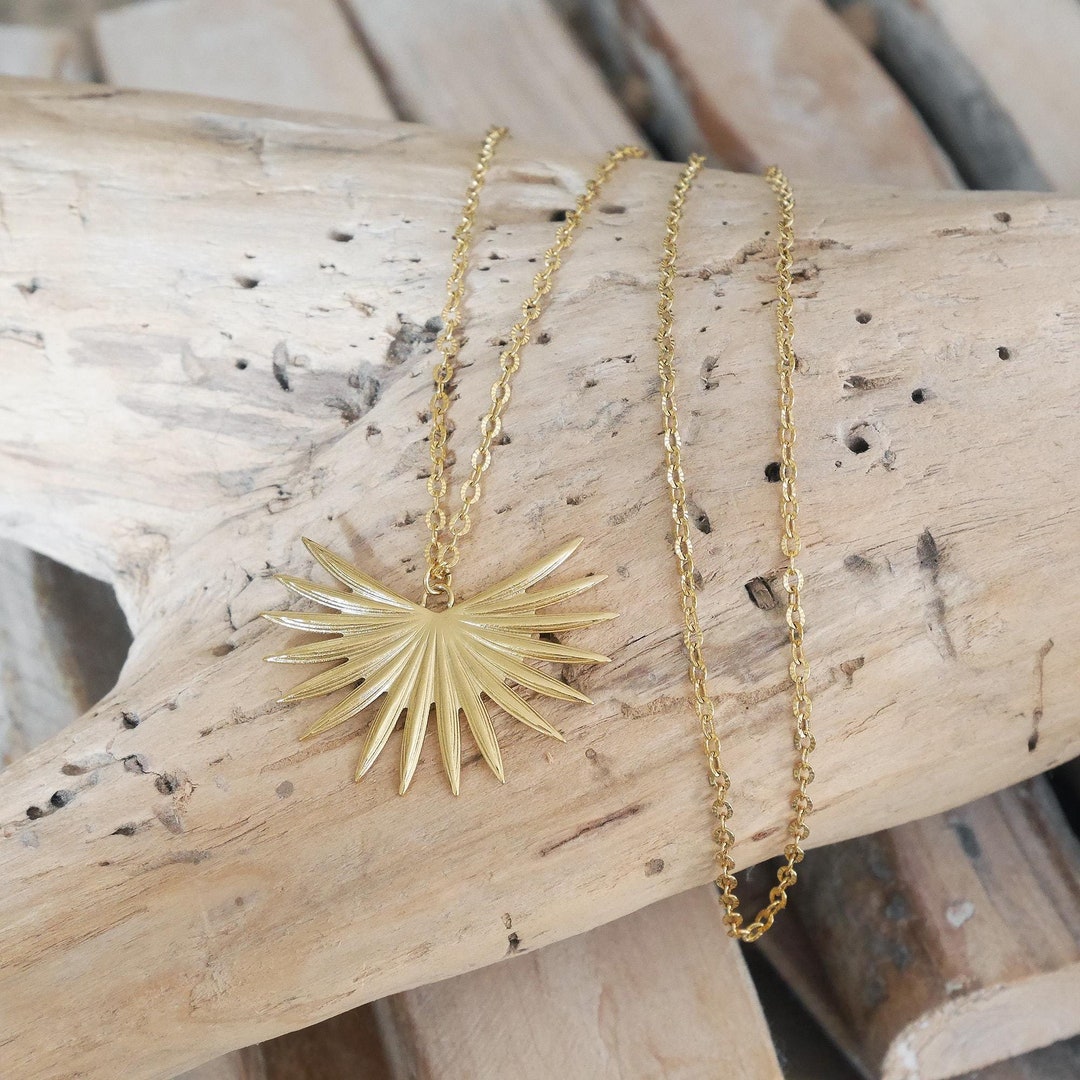 Long Necklace With a Large Sun Pendant in Goldtone Stainless