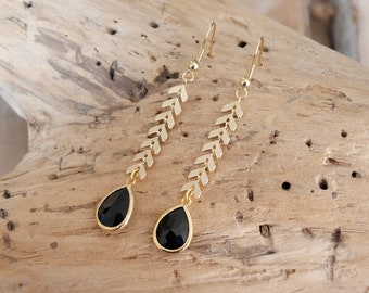 Hanging boho chic earrings in golden spike chain and black drop pendants. Christmas gift woman