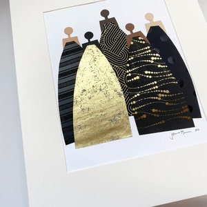 May include: A framed collage of five figures in black and gold dresses. The dresses are made of different patterned papers, including geometric, polka dot, and a gold foil. The artwork is signed "Jenna Mani 2022".