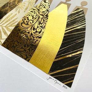 May include: A framed art print featuring a collage of gold and black patterned paper cut into the shape of five figures. The print is signed "Jemma Nunn 2022".