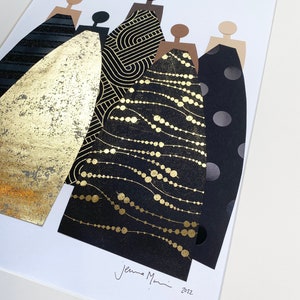 May include: A framed collage of five figures in black and gold dresses. The dresses are made of different patterned paper, including polka dots, geometric shapes, and a gold foil design. The figures are cut out of brown paper and have no facial features. The artwork is signed "Jenna Mani 2022" in the bottom right corner.