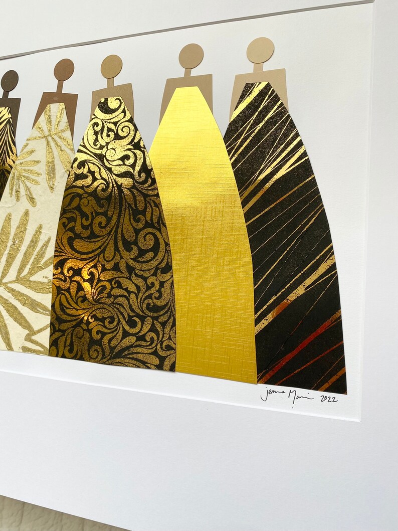 May include: A framed collage of seven figures in gold and black, each wearing a different patterned gown. The artwork is signed "Jenna Marin 2022" in the bottom right corner.