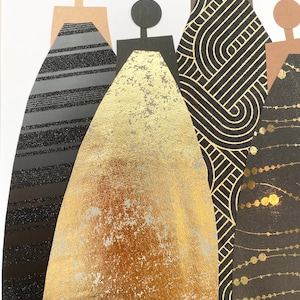 May include: Five paper figures stand in a row, each wearing a different patterned dress. The dresses are black and gold with geometric and abstract designs.