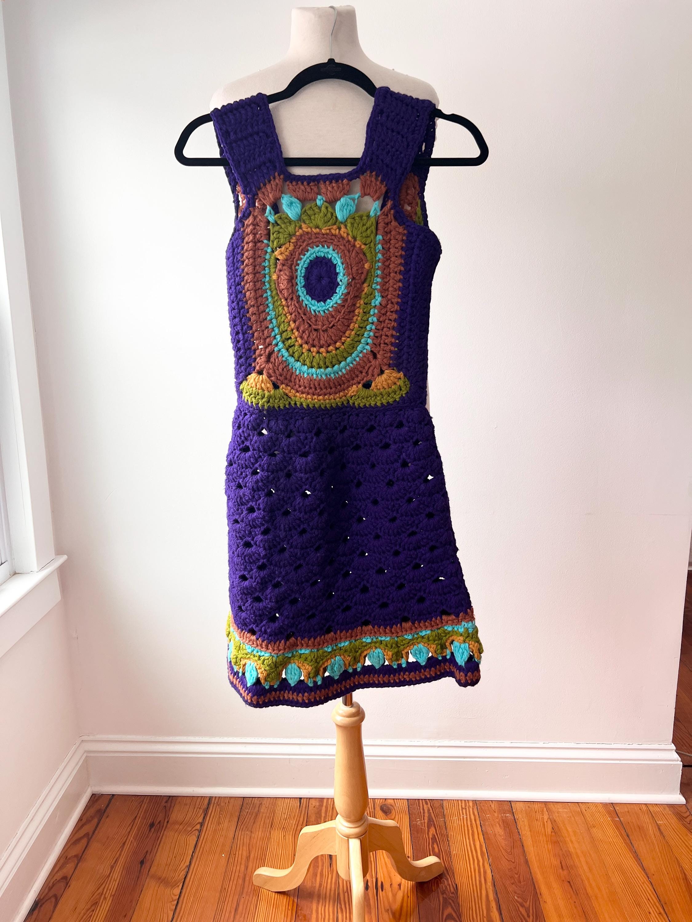 evil eye crochet dress Style it as a dress or pair it with the Evil Eye Hand-Crochet Topeither  way, you'll turn all eyes on you! #skirt #dress #top #resortwear  #handcrochet #emilyinparis