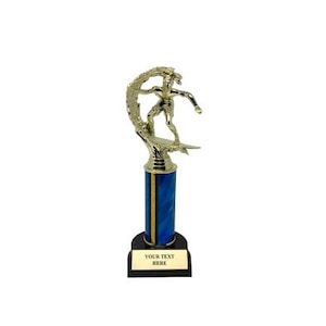 May include: A gold trophy depicting a surfer on a wave. The trophy has a blue and gold column and a black base with a gold plate that reads "YOUR TEXT HERE". This trophy is suitable for surfing events.