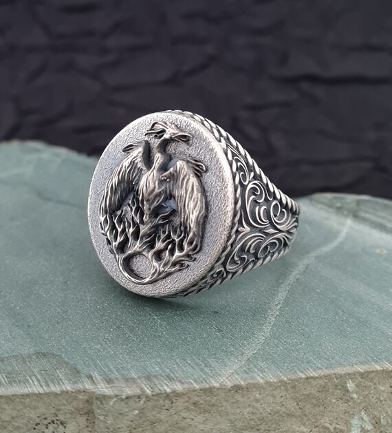 Bague phoenix homme sale