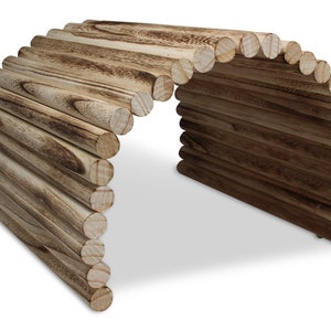 May include: A wooden tunnel made of stacked logs, perfect for small animals to play in. The tunnel is made of natural wood and has a rustic look.