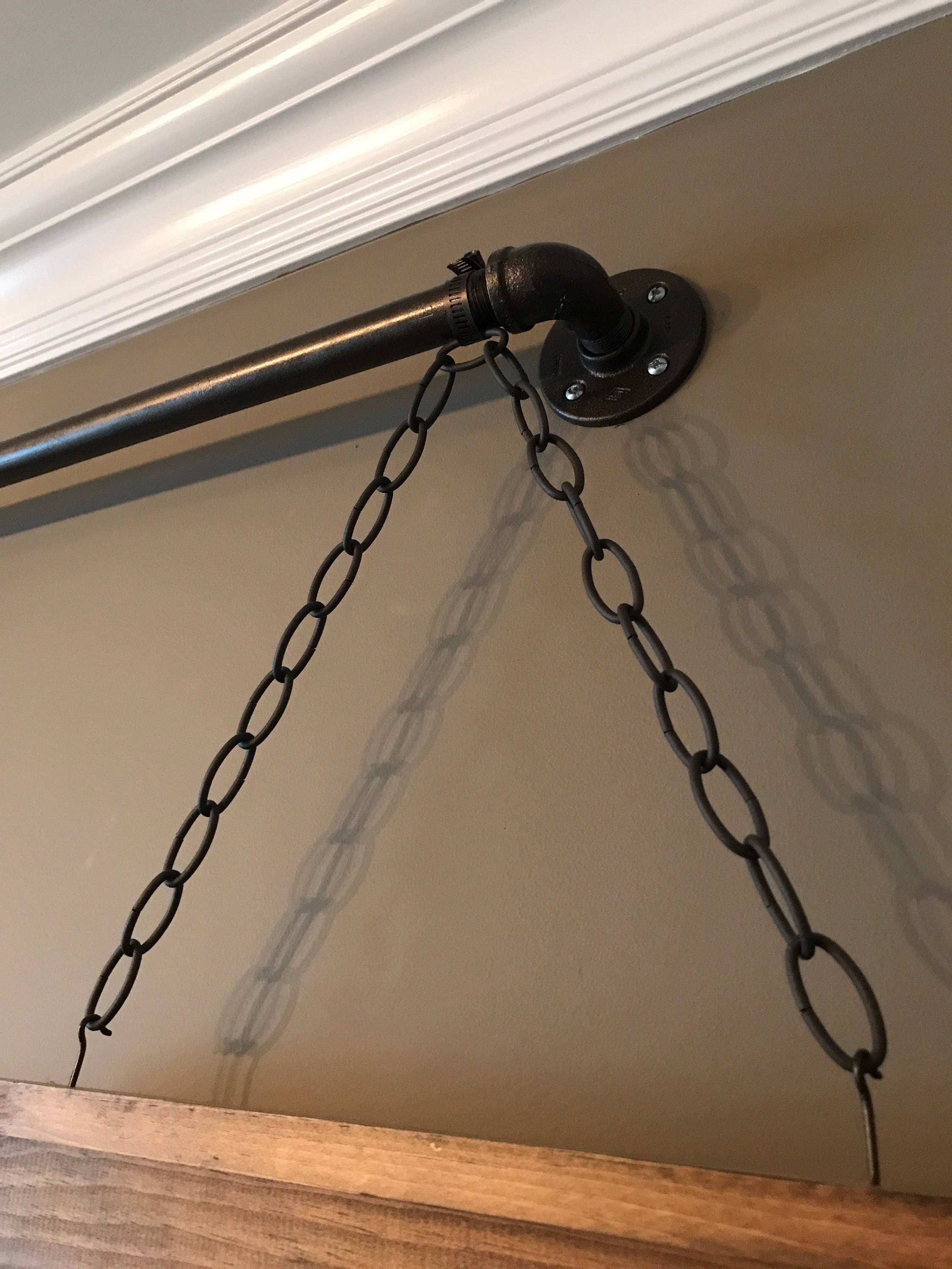 Decorative Hanging Picture Frames Displayed On A Pipe