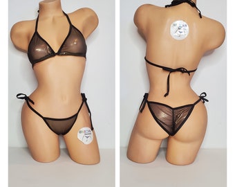 May include: A black bikini set with a halter top and tie-side bottoms. The fabric appears sheer with a metallic gold sheen. The bikini is displayed on a mannequin, showcasing the front and back views of the swimwear.