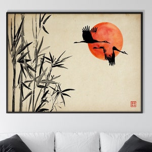 May include: A black and white ink painting of two cranes flying in front of a red sun with bamboo stalks in the foreground. The painting has a traditional Japanese aesthetic.