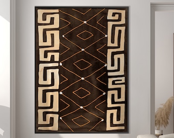 Könnte beinhalten: Ein braunes und beigefarbenes Wandbild mit geometrischem Muster und schwarzem Rahmen, das an einer weißen Wand in einem Wohnzimmer hängt.