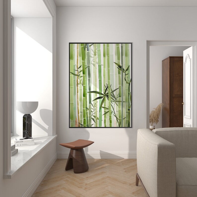 May include: A framed watercolor painting of a bamboo forest with green and brown tones. The painting is hanging on a white wall in a living room setting.