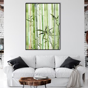 May include: A watercolor painting of a bamboo forest with green and brown stalks and leaves. The painting is framed in a black frame and is hanging on a white wall.