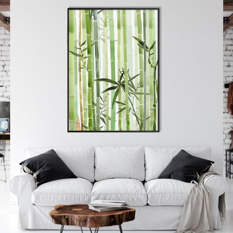 May include: A watercolor painting of a bamboo forest with green and brown stalks and leaves. The painting is framed in a black frame and is hanging on a white wall.