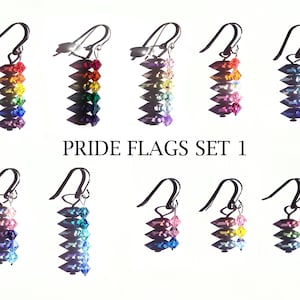 May include: Set of 10 rainbow pride flag earrings. Each earring features a different colour combination of rainbow crystals.
