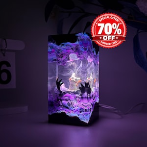 May include: A rectangular resin night light featuring a glowing purple and blue swirling smoke effect. Inside the clear block, a small white creature figure with black accents is visible. The top right corner displays a red circular badge with the text SPECIAL OFFER 70% OFF LIMITED TIME.