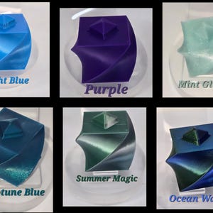 May include: Six 3D-printed twisted cube containers with pyramid-shaped lids in various colours: Light Blue, Purple, Mint Glitter, Neptune Blue, Summer Magic, and Ocean Water. Each cube features a spiralling geometric design and a square base.