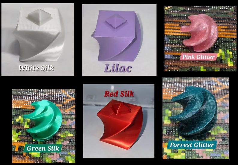 May include: A collection of six 3D printed geometric objects featuring a twisted square prism design with a pyramid top. The colours include white silk, lilac, pink glitter, green silk, red silk, and forest glitter, each labelled with its colour name.