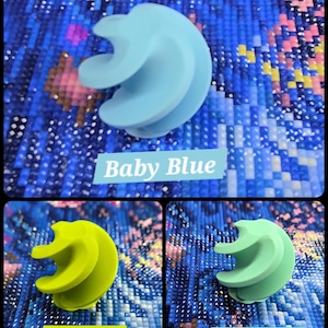 May include: Three spiral-shaped tools in baby blue, lime green, and pastel mint. The tools are displayed against a blue background. Text labels identify each tool's color: "Baby Blue", "Lime Green", and "Pastel Mint".