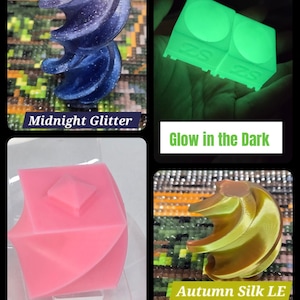 May include: A collage of four items. Top left: a dark blue, glittery, spiral-shaped object with the text "Midnight Glitter". Top right: two green, square objects that glow in the dark, with the text "Glow in the Dark". Bottom left: a pink, geometric object with the text "Baby Pink". Bottom right: a gold spiral-shaped object with the text "Autumn Silk LE".