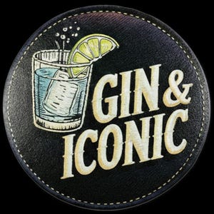 May include: A circular black coaster with a stitched edge featuring a graphic of a glass filled with a clear liquid, ice cubes, and a lime wedge. The text GIN & ICONIC is printed in a large, cream-colored serif font to the right of the glass illustration.