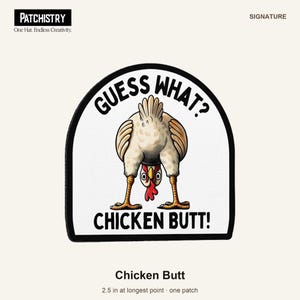 May include: A white, arched patch with a black border featuring an illustration of a chicken bending over. The text "GUESS WHAT?" is printed above the chicken, and "CHICKEN BUTT!" is printed below. The patch measures 2.5 inches at its longest point.