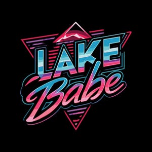 May include: A graphic design featuring the text LAKE BABE in a stylised font. The letters are filled with horizontal stripes of blue, purple, and pink. The design is set against a black background with a large pink triangle and horizontal lines.