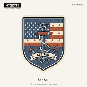 May include: A shield-shaped patch featuring a stylised American flag background with a central grey anchor wrapped in white rope. A banner across the bottom reads SET SAIL. The patch measures 6.35 cm at its longest point.