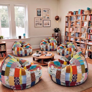 May include: Five bean bag chairs arranged in a circle around a round wooden coffee table. Each chair is covered in a patchwork fabric featuring a variety of colourful patterns, including floral, geometric, and solid-coloured squares in bright tones.