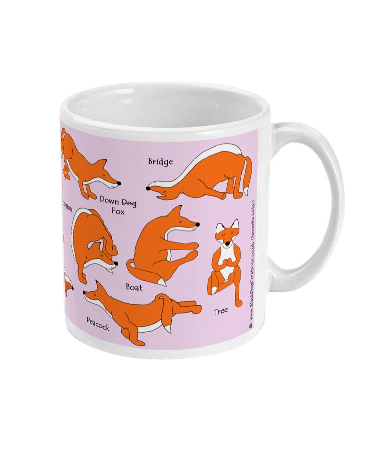May include: White ceramic mug with a pink background featuring illustrations of a fox in various yoga poses. The poses are labeled with the names: Bridge, Down Dog Fox, Boat, Tree, and Peacock.
