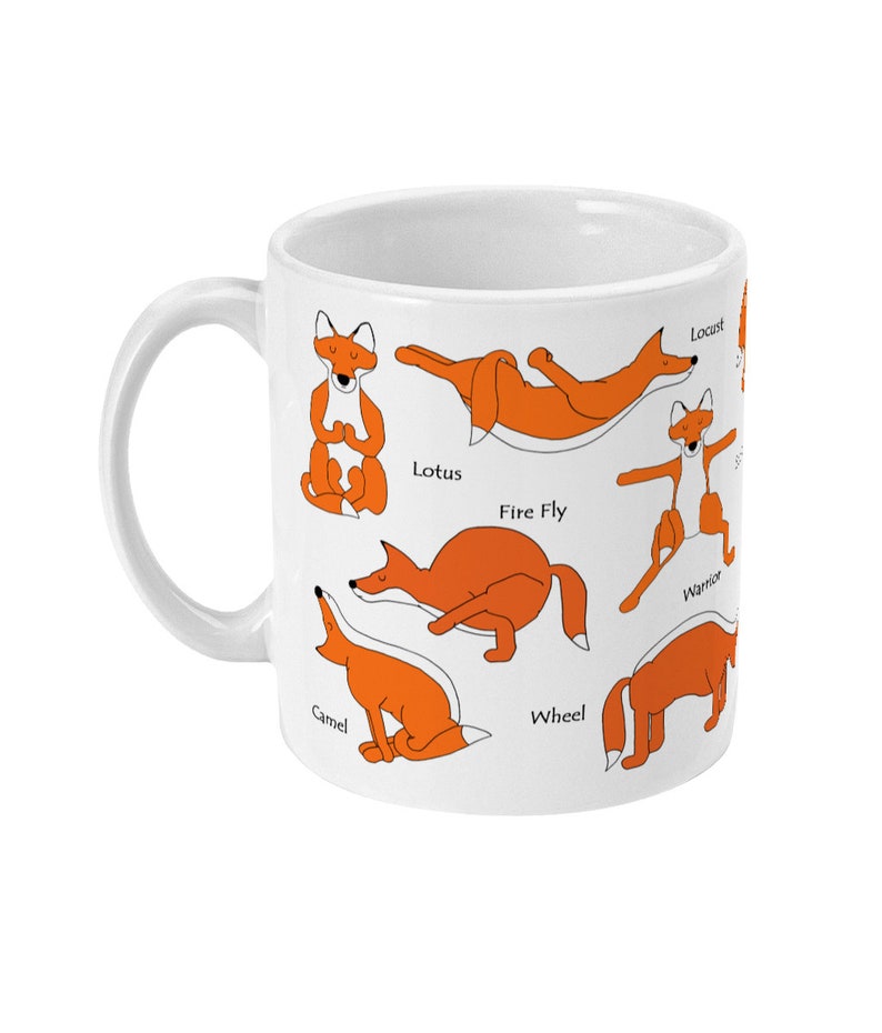 May include: White ceramic mug with an orange fox in different yoga poses, including Lotus, Fire Fly, Warrior, Camel, Wheel, and Locust. The poses are labeled with their names.