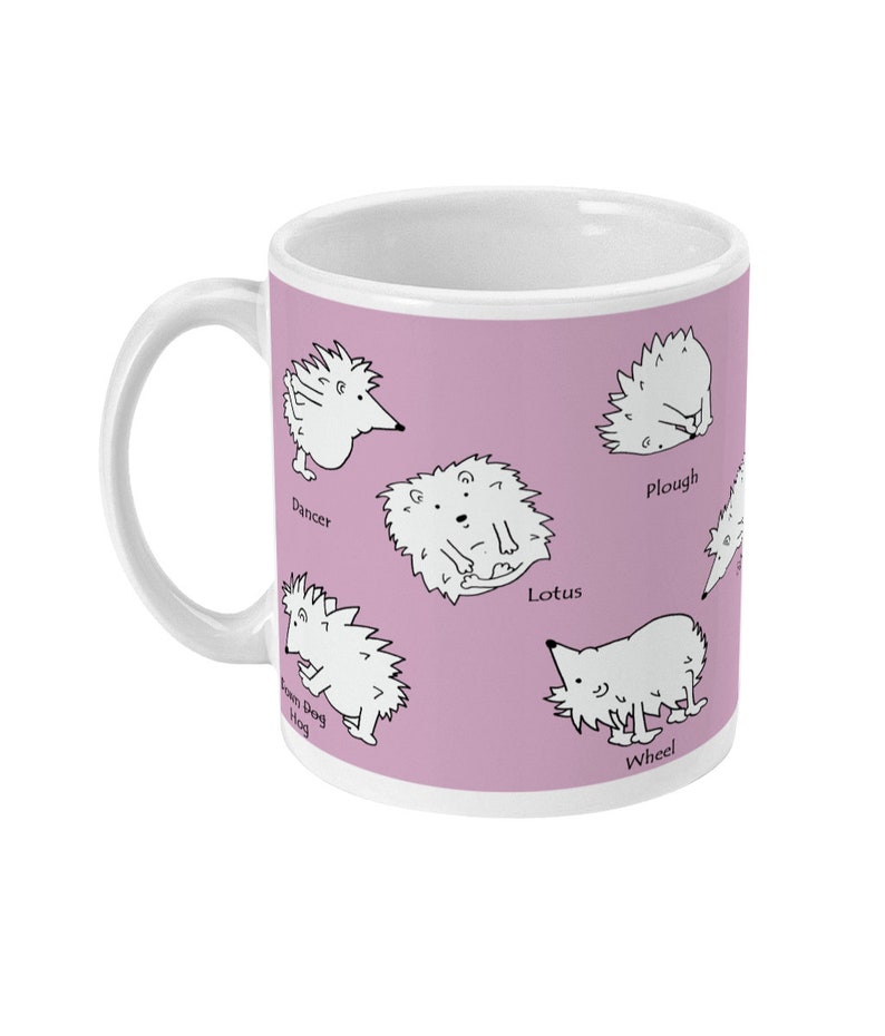 May include: White ceramic mug with a light purple background featuring cartoon hedgehogs in various poses. The mug has a white handle and the names of the poses are printed below each hedgehog. A fun and whimsical design.
